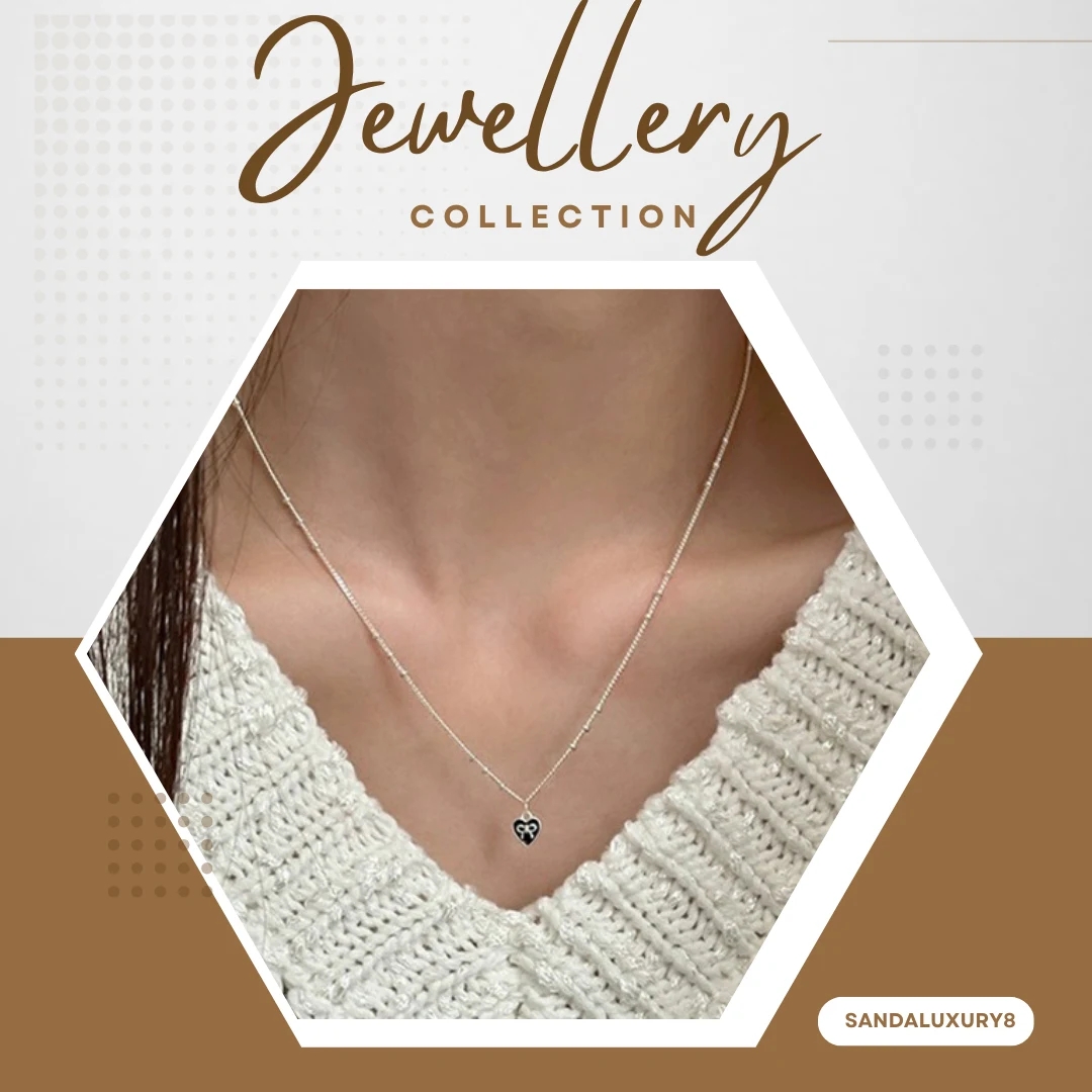 Silver chain necklace with black heart pendant - image 1